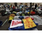Signs lay atop a pile of bedding Signs lay atop a pile of bedding